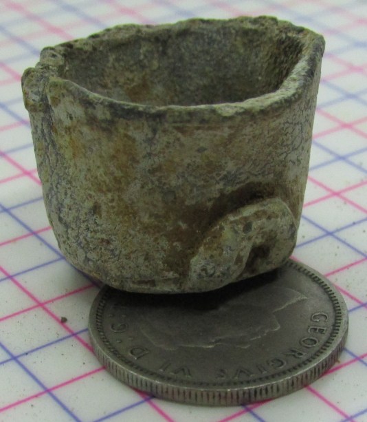 Powder Cap sitting on a sixpence